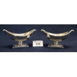 Pair of Victorian silver boat shaped fluted salts on square bases, London hallmarks, makers mark