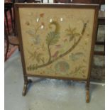 Early 20th Century firescreen on stand depicting exotic bird amongst foliage. (B.P. 21% + VAT)