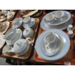 Two trays of Doulton tea and dinnerware items on a blue and white banded ground, modern. (2) (B.P.