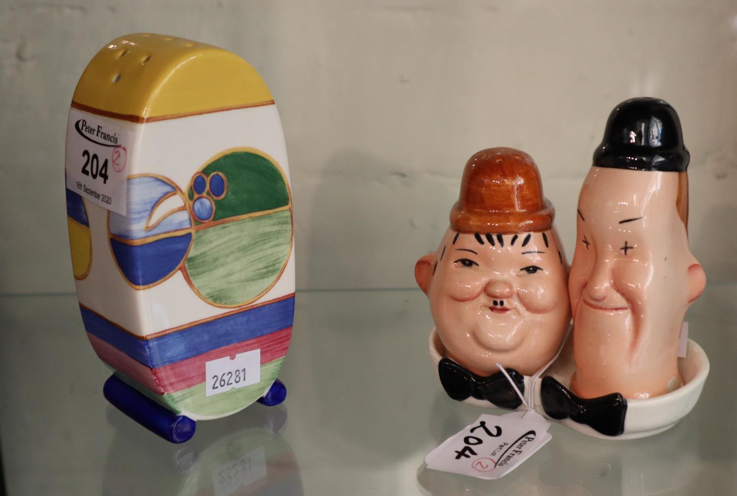 Wedgwood Clarice Cliff collection sugar sifter, together with a Beswick Laurel and Hardy cruet