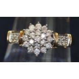 9ct gold diamond cluster ring with diamond set shoulders. Ring size R. Approximate weight 2.8g. (B.