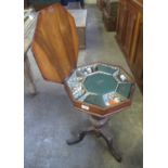 Victorian octagonal walnut parquetry inlaid ladies work box with hinged lid on a carved tripod base.