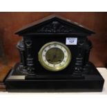 Late 19th/ Early 20th century architectural slate two train mantel clock having moulded mask head