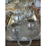 Four piece silver plated tea service, together with a two handles silver plated tray decorated