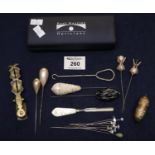 Engraved brass thread holder, sovereign scales and a collection of hat pins. (B.P. 21% + VAT)