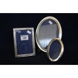 Collection of three silver picture frames, two of oval form. (B.P. 21% + VAT)