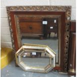 Two modern mirrors, one with foliate frame and bevel plate, the other with mirrored frame and gilt