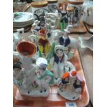 Tray of assorted 19th Century Staffordshire flat back and other figurines, spill vases etc. (B.P.