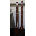 Large pair of carved fork and spoon probably for display purposes. (B.P. 21% + VAT)
