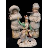 Pair of German continental figurines, together with another continental figure of a soldier. (B.P.