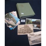 Box of assorted postcards and a small empty postcard album. (B.P. 21% + VAT)