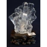 Oriental probably Chinese moulded glass Buddhistic figure simulating carved drop crystal on a carved