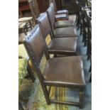 Set of four early 20th Century oak dining chairs, the backs and seats with leather upholstery and