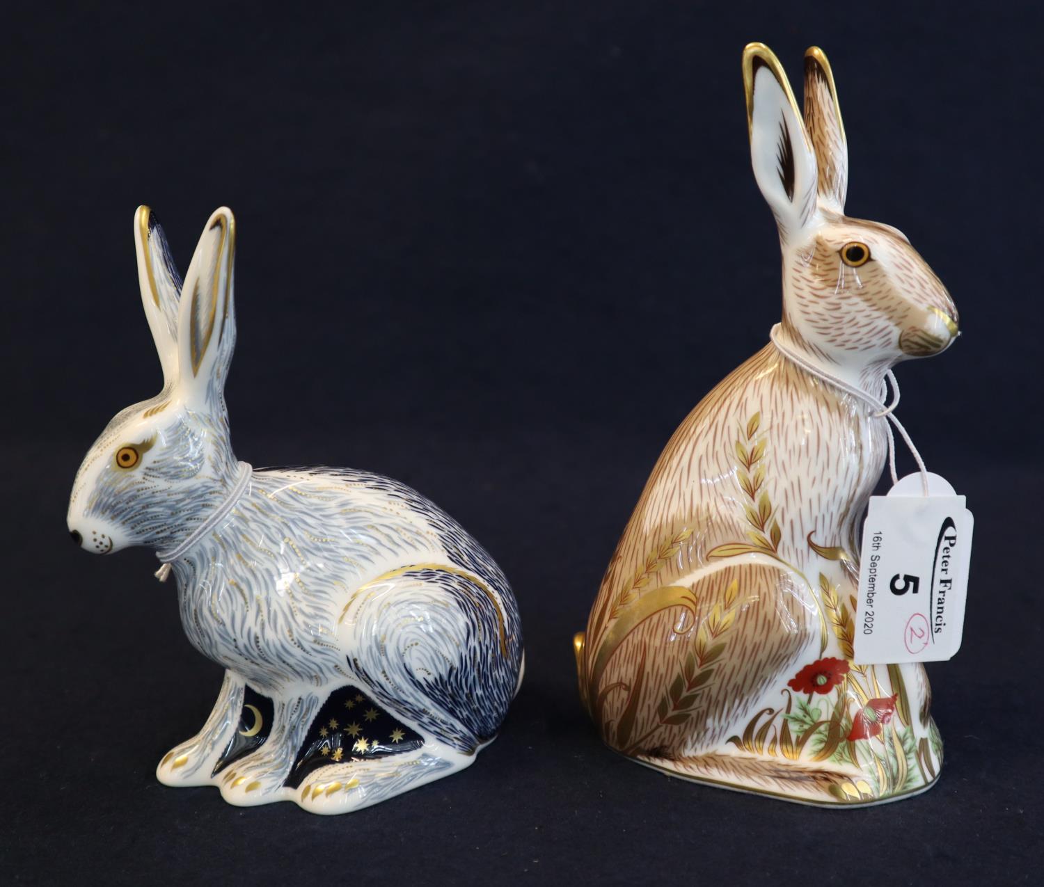 A Royal Crown Derby bone china paperweight, 'Starlight Hare' in original box with gold stopper.