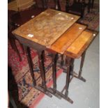 Victorian mixed woods nest of three tables, in very poor, distressed condition with losses to