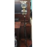 Early 20th century oil burner standard lamp having wrythen design shade and clear glass reservoir