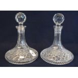 A pair of hobnail cut glass ship's type decanters with facet stoppers. (2) (B.P. 21% + VAT)