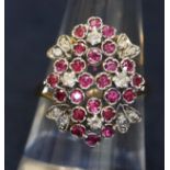 18ct gold diamond and ruby cluster ring. Ring size O&1/2. Approximte weight 5.6g. (B.P. 21% + VAT)