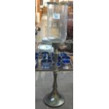 Modern candlelight on tall glass stem with circular base and clear glass shade. (B.P. 21% + VAT)