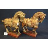 A decorative pair of Tang style carved wooden horses on rectangular bases. (B.P. 21% + VAT)