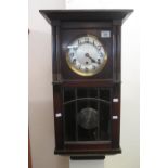 Mid Century mahogany three train drop dial wall clock with silvered face. With pendulum and key. (