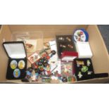Box containing Robertson Golly musical band figurines and footballers and other similar ephemera