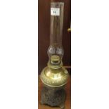 Early 20th century oil burner marked made in USA having clear glass chimney with brass rep-rouse