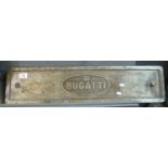 Bugatti motor cars, a cast aluminium probably workshop sign with two large mounting bolts. 77 x 18