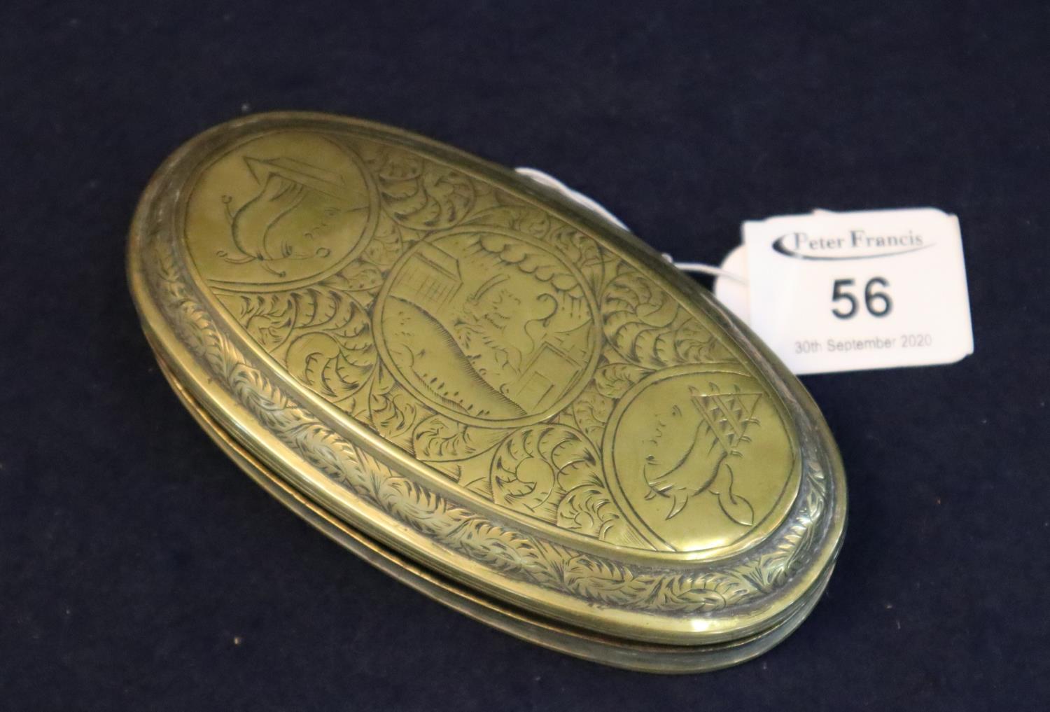 19th century brass, oval-shaped snuff box with hinged cover and engraved decoration depicting