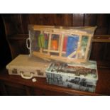 Tapestry frame vintage suitcase and two vintage biscuit tins. (B.P. 24% incl. VAT)