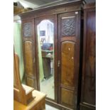 Edwardian mahogany and walnut three door wardrobe with mirror centre, hanging and base and