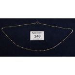 14 ct gold fine link necklace with ball decoration. 4g approx. (B.P. 21% + VAT)