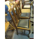 A pair of early 20th century oak dining chairs with drop in seats, together with a 20th century teak