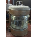 A ship's brass, clear glass mast head lantern. With carrying handle. 43 cm high approx overall. (B.