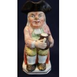 Georgian period Toby jug, modelled as traditional toper, clutching his clay pipe and foaming tankard