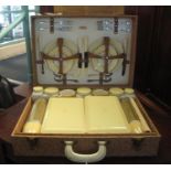 A Sirram-cased picnic set, fully fitted to the interior with cutlery, china, storage jars,