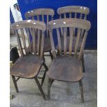 Similar set of four stained slat backed Windsor type kitchen chairs on ring turned baluster legs. (