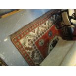 Middle Eastern red ground geometric rug with tarantula design gulls. 175 x 222 cm approx. (B.P.