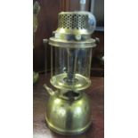 A Palux model 300 brass storm lantern, primers type pressure action and spring swing handle. 35 cm