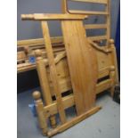 Two pairs of pine double bed steads with side rails and slats, together with a