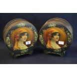 Pair of Japanned metal drum-head-shaped biscuit tins with printed portrait decoration and Art