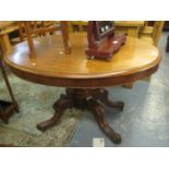 Victorian mahogany centre table of oval form standing on a pedestal base and castors. (B.P. 21% +