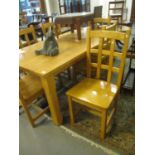 Large modern beech kitchen table of rectangular form with square chamfered legs together with a