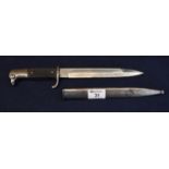 German WWII bayonet with single edged fullered blade, scaled grip and steel scabbard. Unmarked. 34