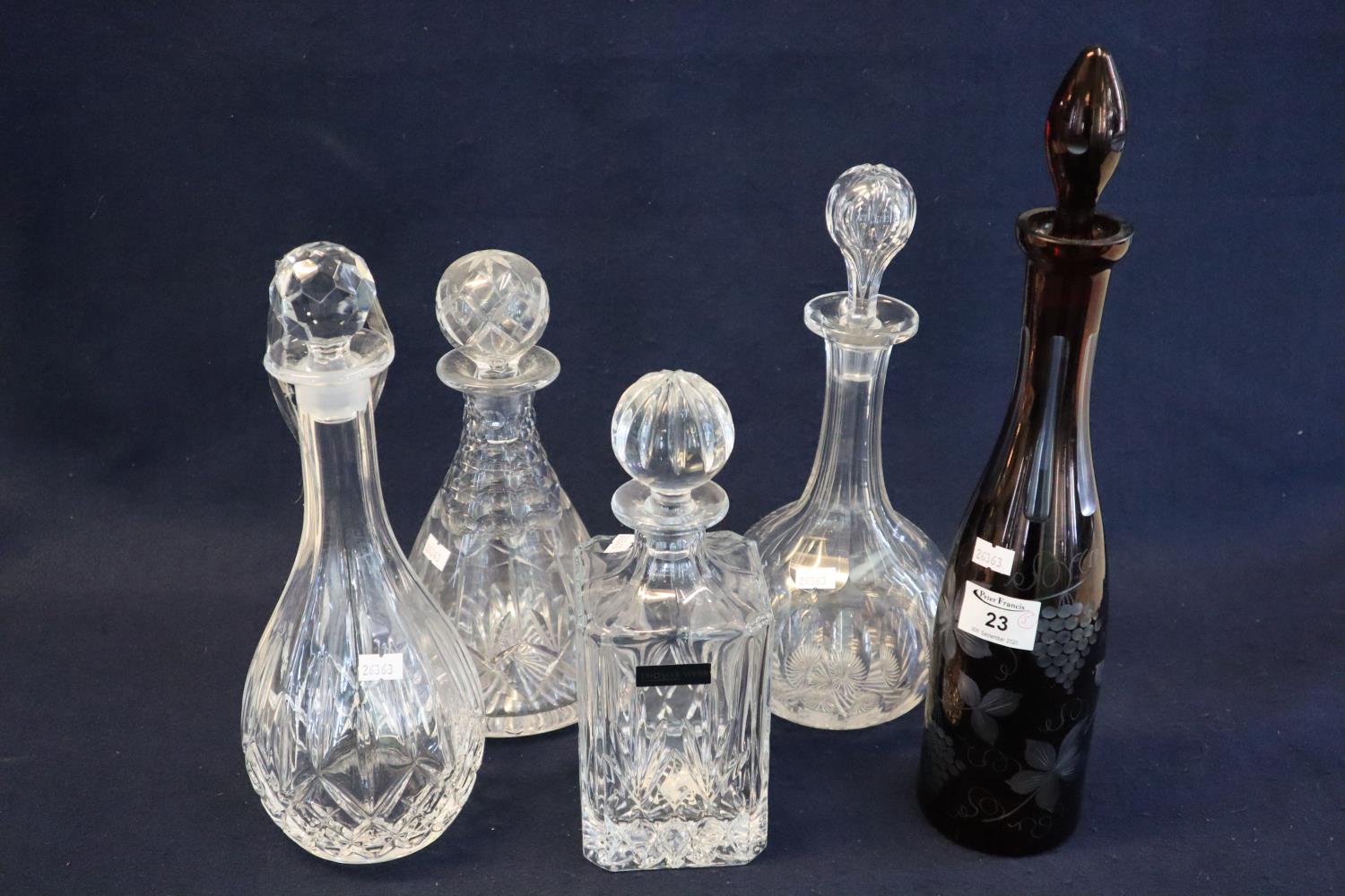 Collection of cut glass decanters and stoppers to include Thomas Webb conical shaped design etc.