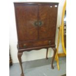 Reproduction walnut two door blind panel drinks cabinet on stand. (B.P. 21% + VAT)