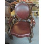 Victorian style mahogany walnut framed open armed chair with leather and metal stud work design on