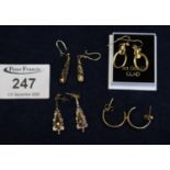 Pair of 9 ct gold oval earrings, together with other gold earrings. (B.P. 21% + VAT)