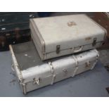 A vintage metal banded trunk, together with a cream suitcase. (B.P. 21% + VAT)