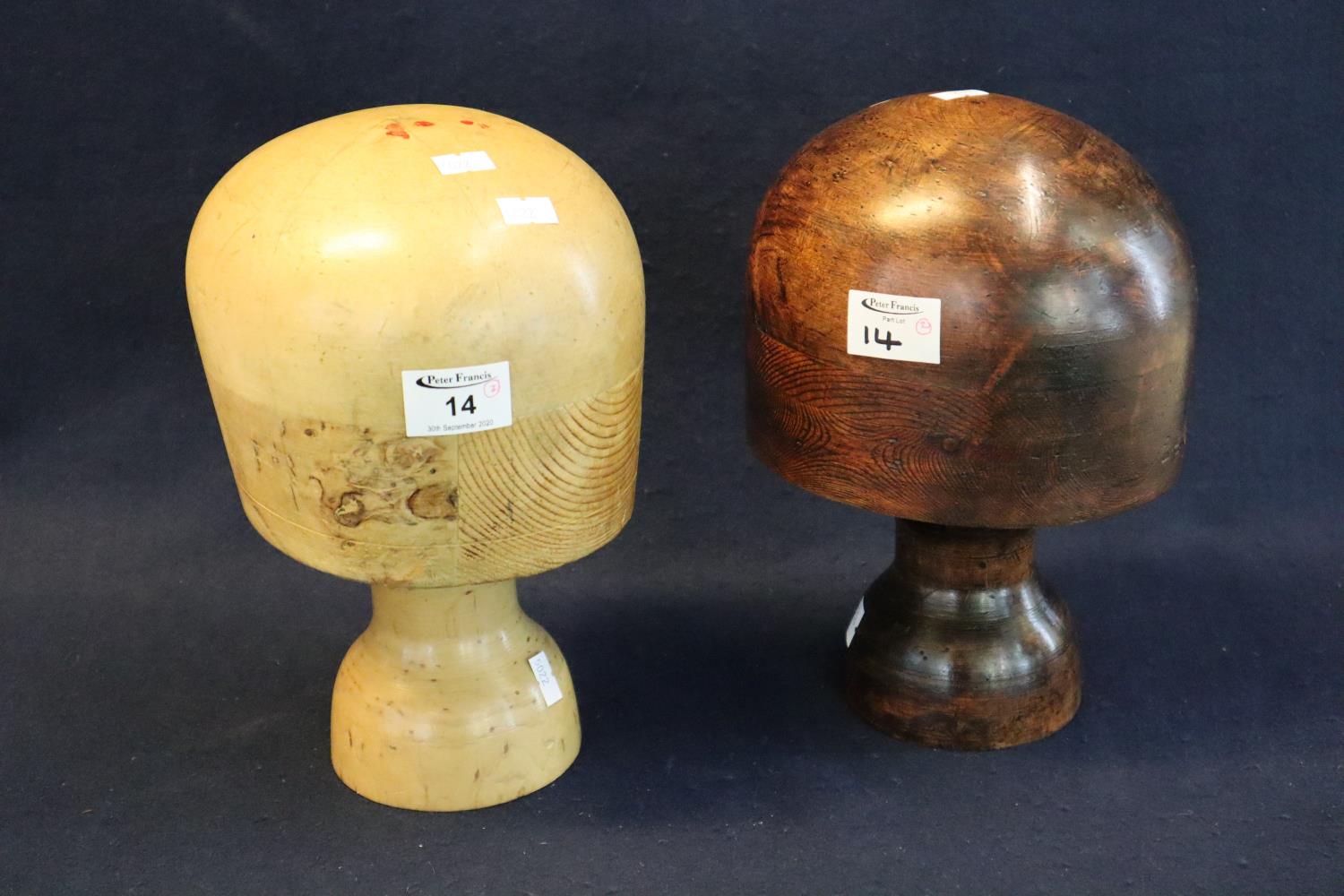 Two milliners wooden hat stands both stamped 22 inches. (B.P. 21% + VAT)